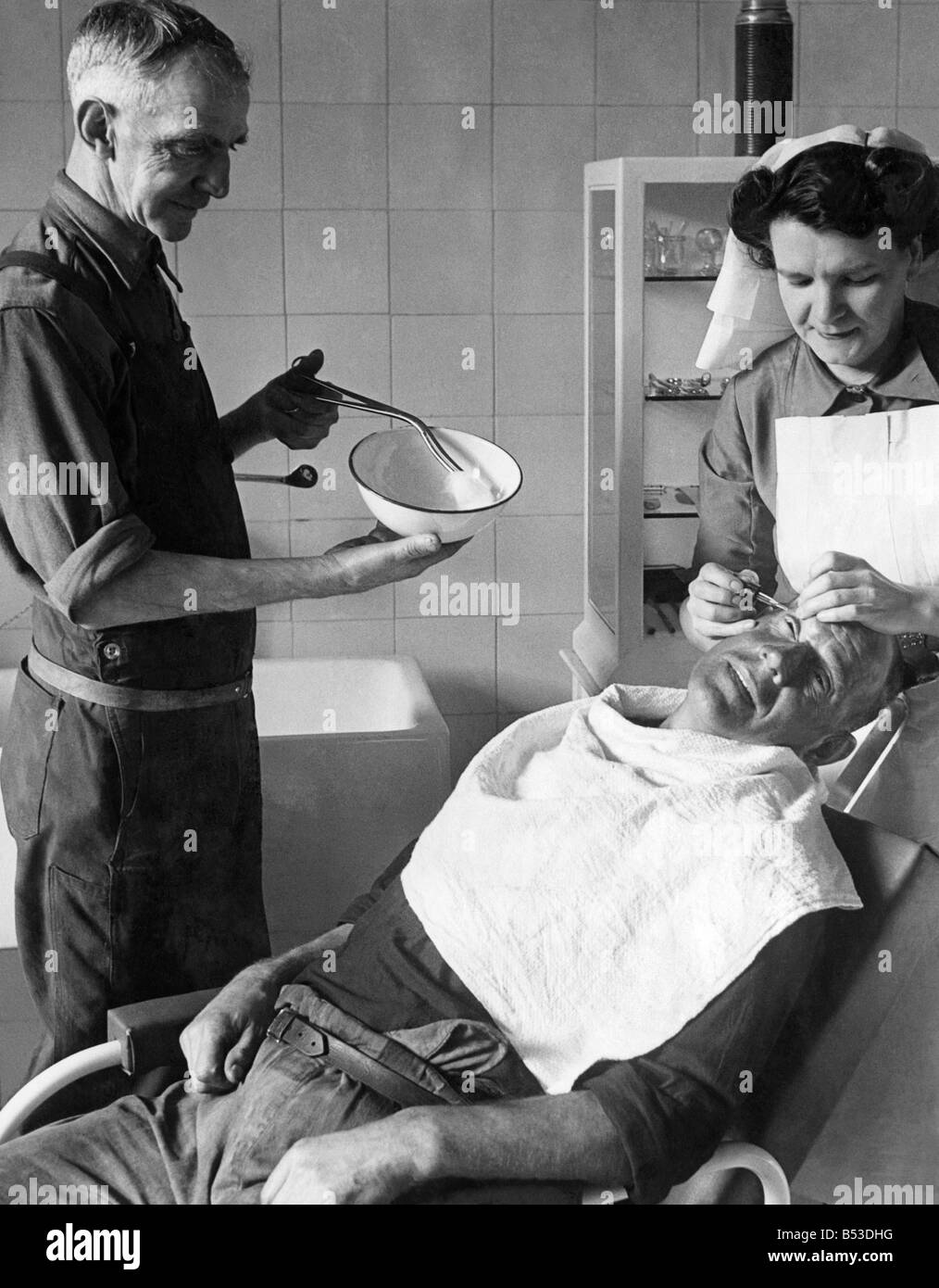 Another pithead medical centre has been opened at Coegnant Colliery in the Llanfi Valley. Nurse checking up on a miner;Feb. 1949 Stock Photo