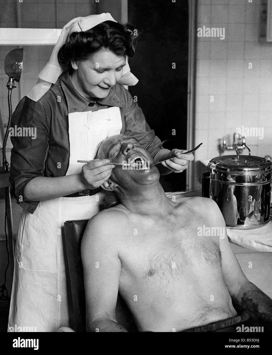 Another pithead medical centre has been opened at Coegnant Colliery in the Llanfi Valley. Nurse checking up on a miner;Feb. 1949 Stock Photo