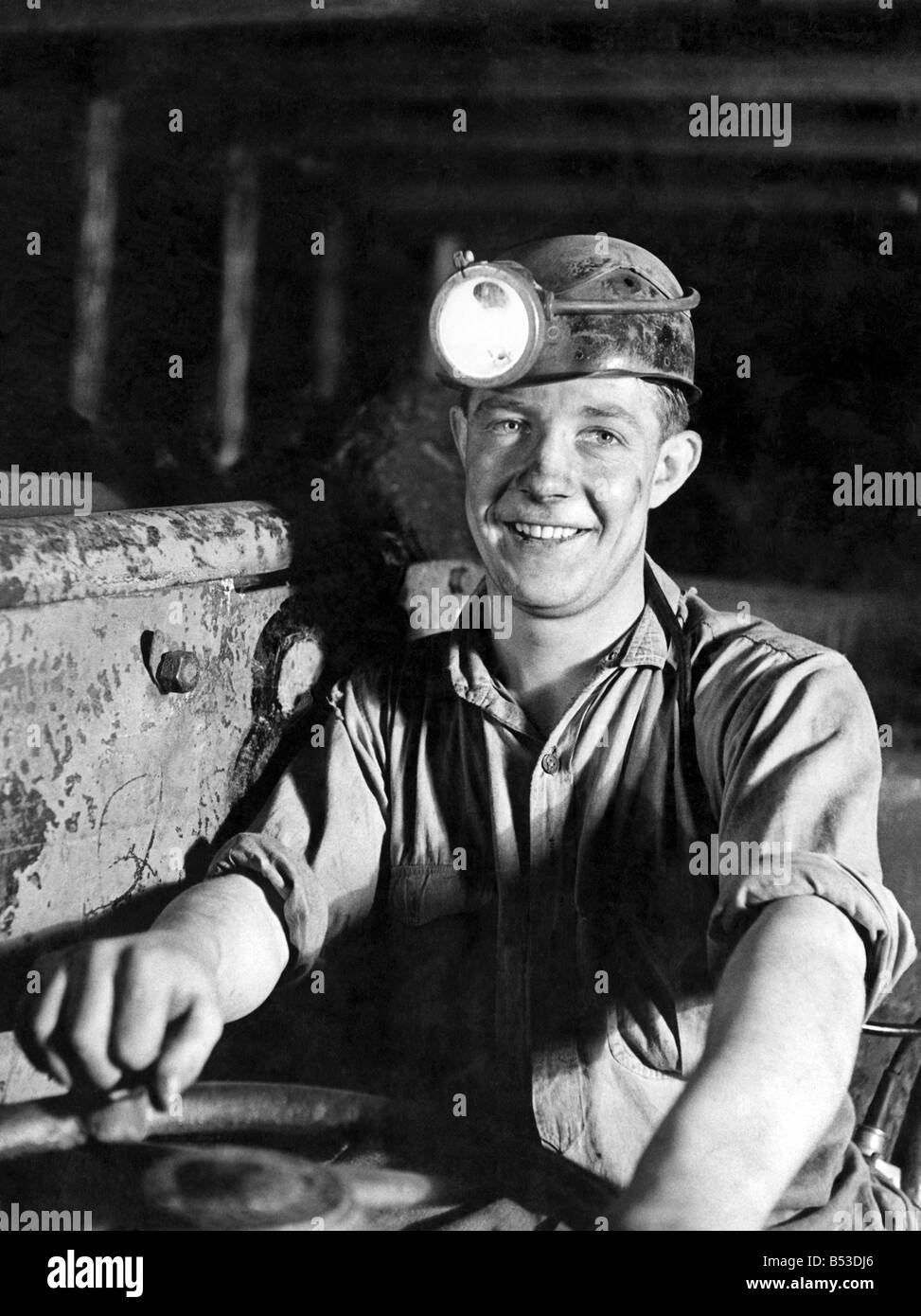 Whitehill Midlothian, Scotland. Mechanised coal mining. Envy of all the other Bevin-Boys is young James Turner, who drives on of the electric shuttle-cars at Newbattle Colliery. July 1946 P017718 Stock Photo