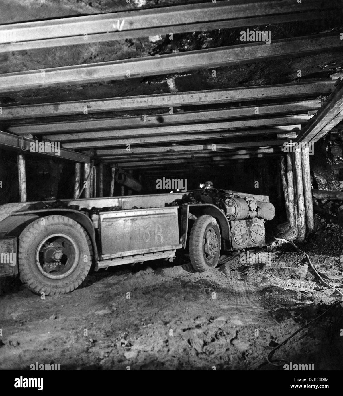 Mechanised mining. Powered by electric batteries, this shuttle-car is used to take coal from the coal-face to the conveyor belt. 1946 ;P017725 Stock Photo