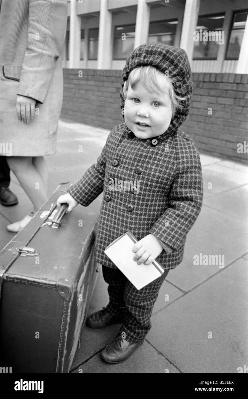 Boy on suitcase 1960s hires stock photography and images Alamy