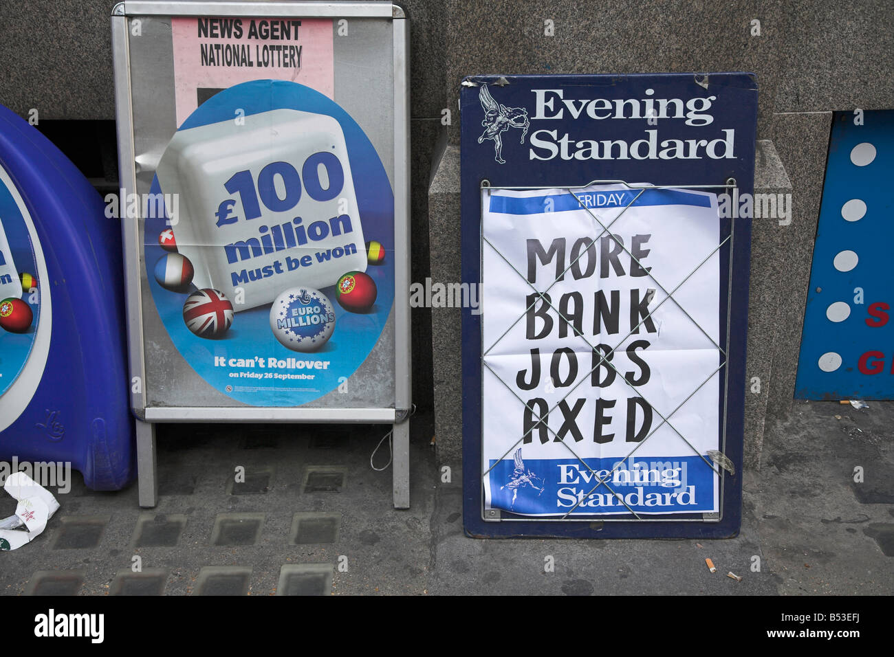 Banking crisis headlines job losses alongside advert for lottery Stock Photo