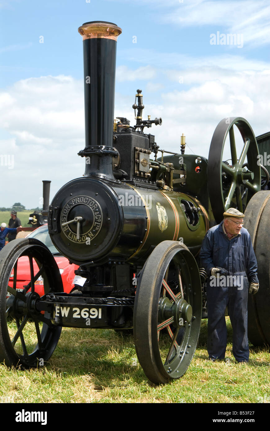 A man and his Ruston Proctor steam powered traction engine at Bloxham Vintage Vehicle and Country Show. UK. Stock Photo