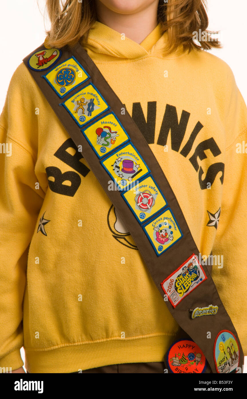 10 Year Old Girl Dressed In Brownies Uniform Showing Her Collection Of 10-year-old-girl-dressed-in-brownies-uniform-showing-her-collection-of