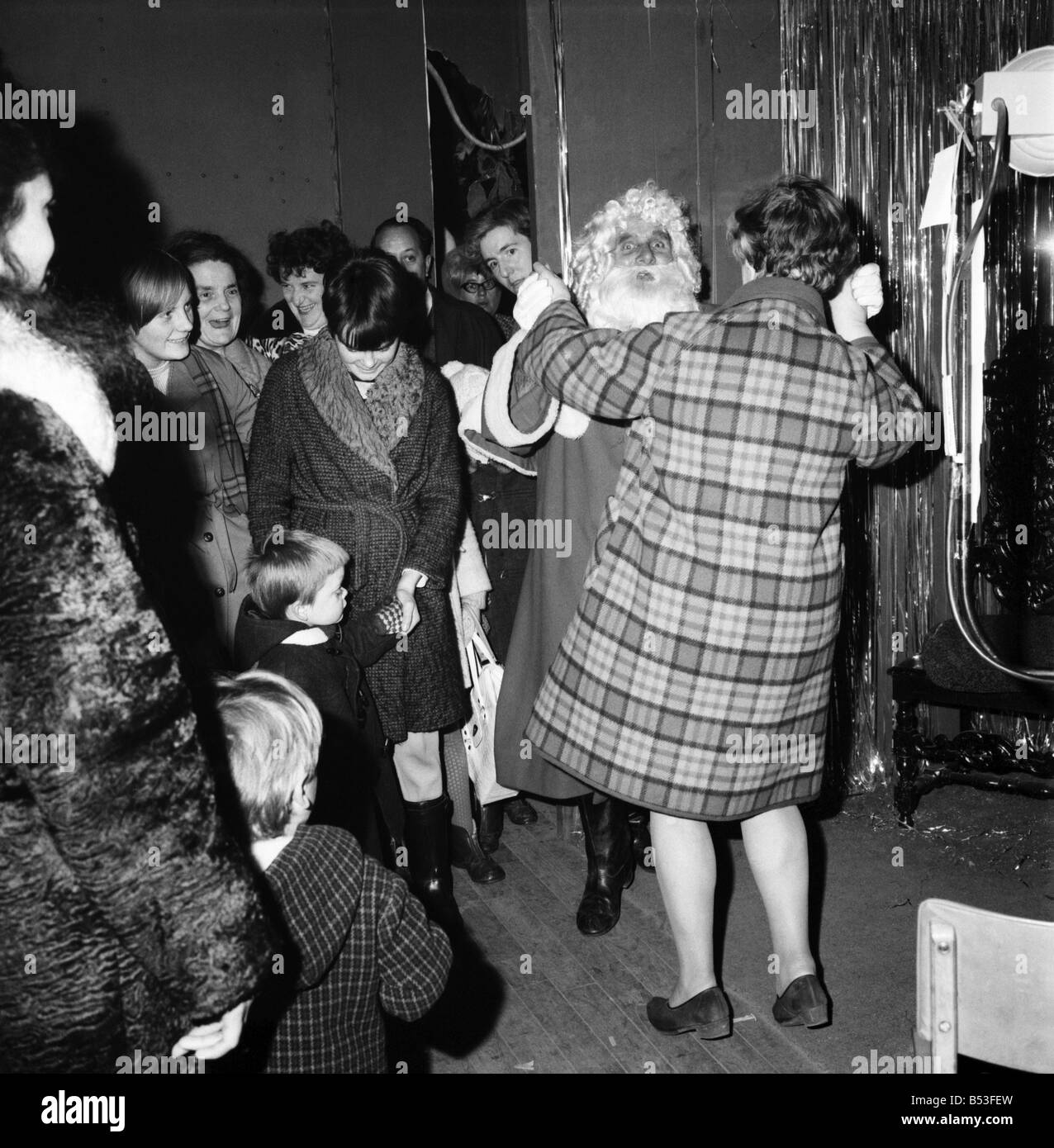 Christmas Humour - Santa. Father Christmas enjoys a dance at Lewis's store in Manchester. December 1969 Z11812-001 Stock Photo