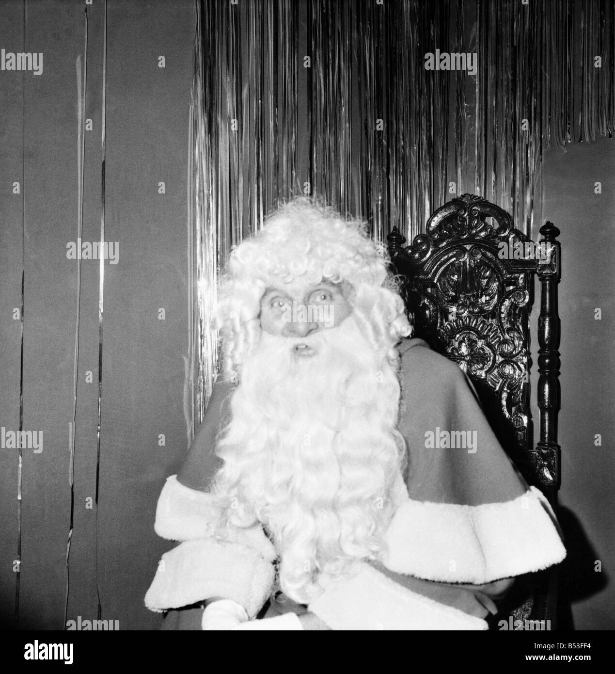 Christmas Humour - Santa. Father Christmas at Lewis's store in Manchester. December 1969 Z11812 Stock Photo