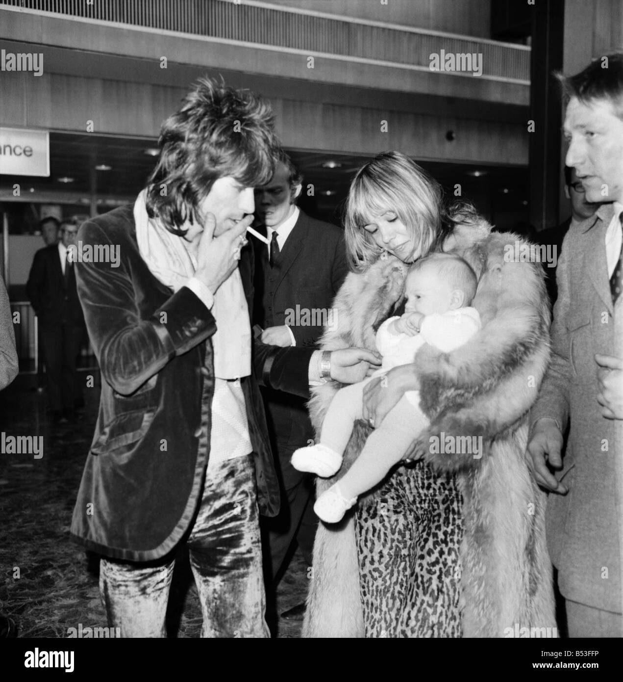 Rolling Stones, Charlie Watts and Keith Richard arrived at Heathrow Airport today from Los Angeles. They were met by Charlie Watts' wife and daughter, and the girlfriend of Keith Richard, Anita Pallenberg with their 4 months old baby Marlon. (left to right) Keith Richard and Charlie Watts pictured at Heathrow Airport . December 1969 Z11832-001 Stock Photo