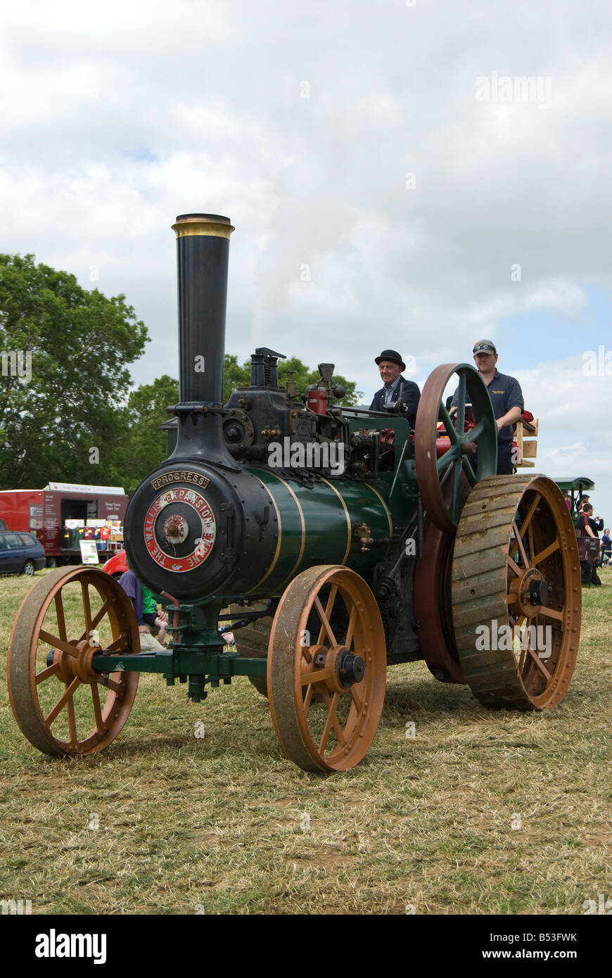 Enthusiast traction engine owners driver their Wallis Stevens vehicle