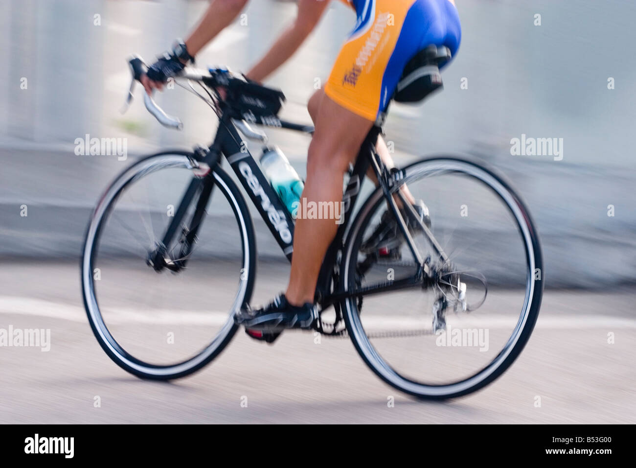 A morning cyclist speeding by Stock Photo