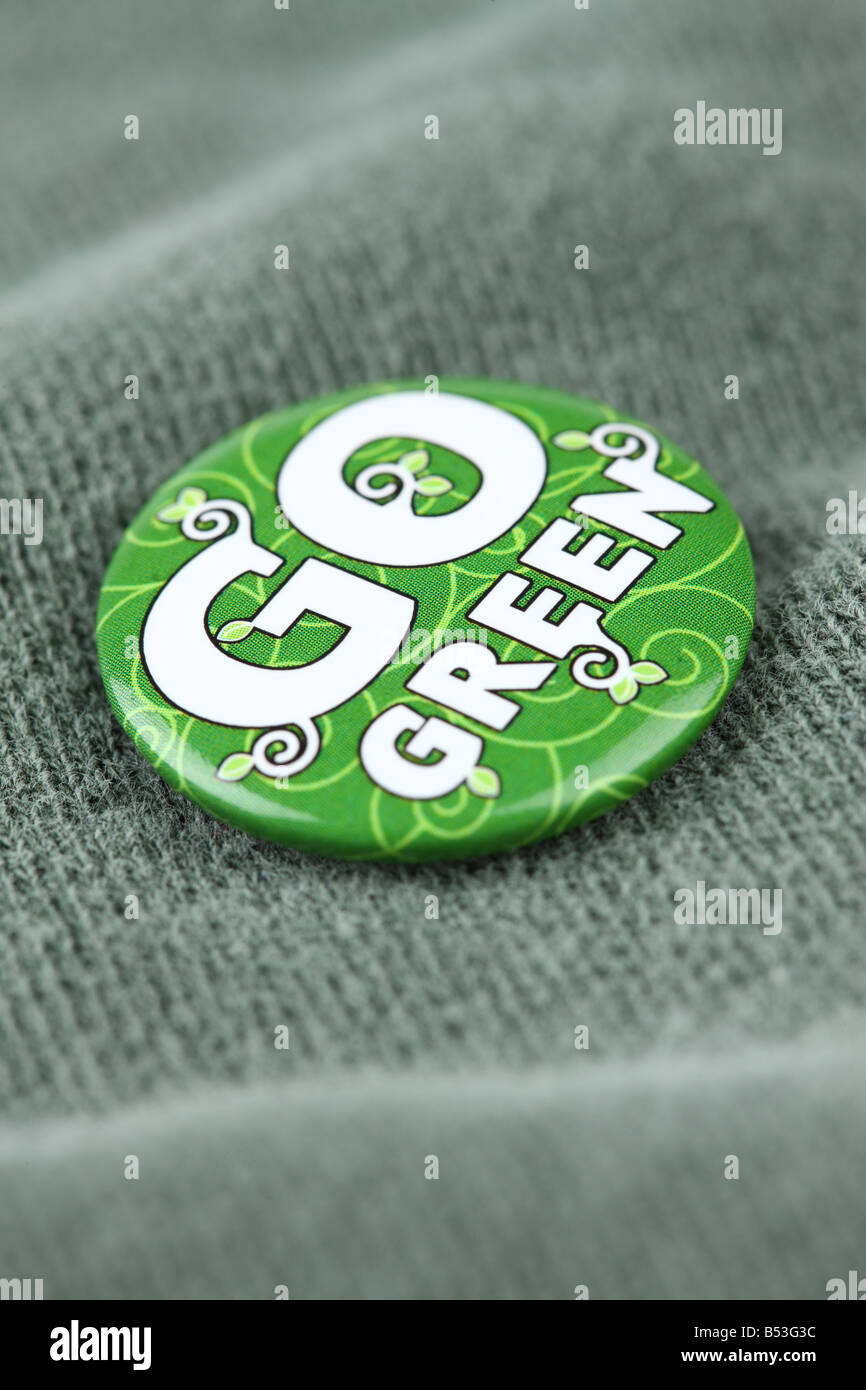 Go Green pin on shirt close up Stock Photo