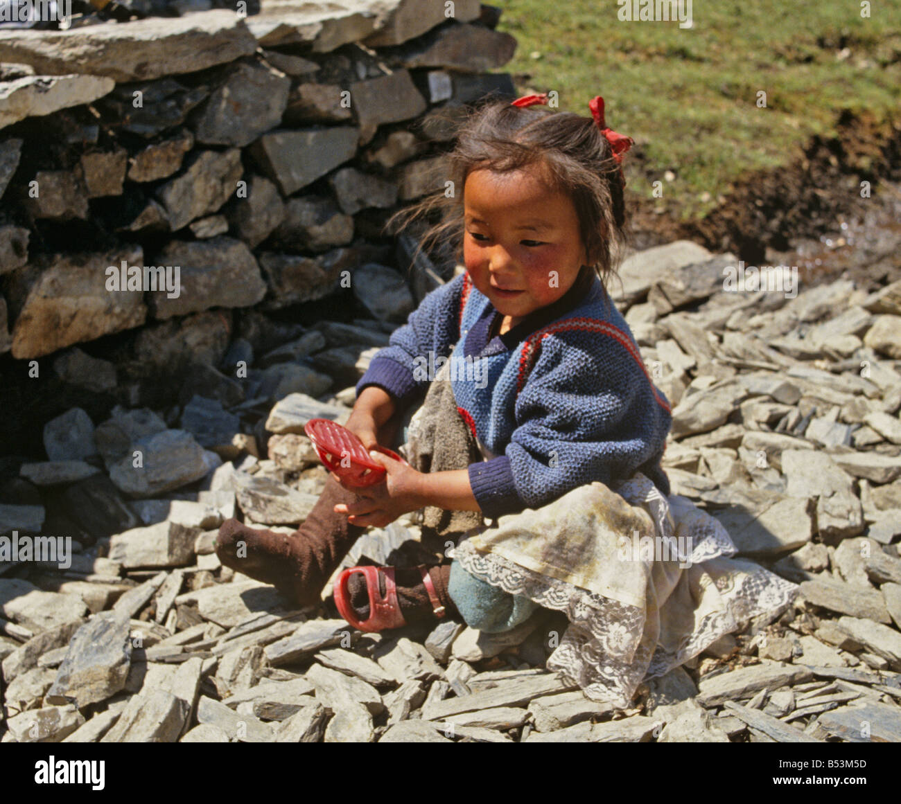 Young Girl With Wellington Boot Annapurna Region Himalayas Nepal Asia Stock Photo