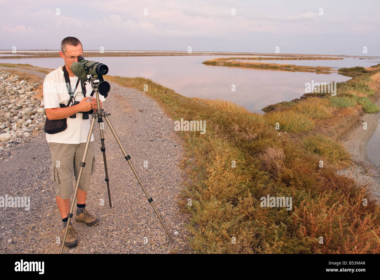 Birdwatcher scanning the terrain in Greece Stock Photo