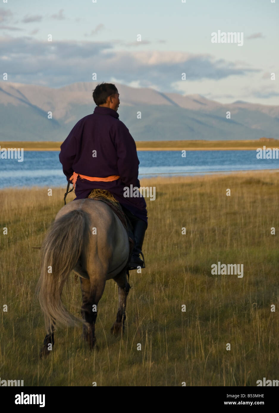 Nomad riding his horse North Mongolia Stock Photo - Alamy