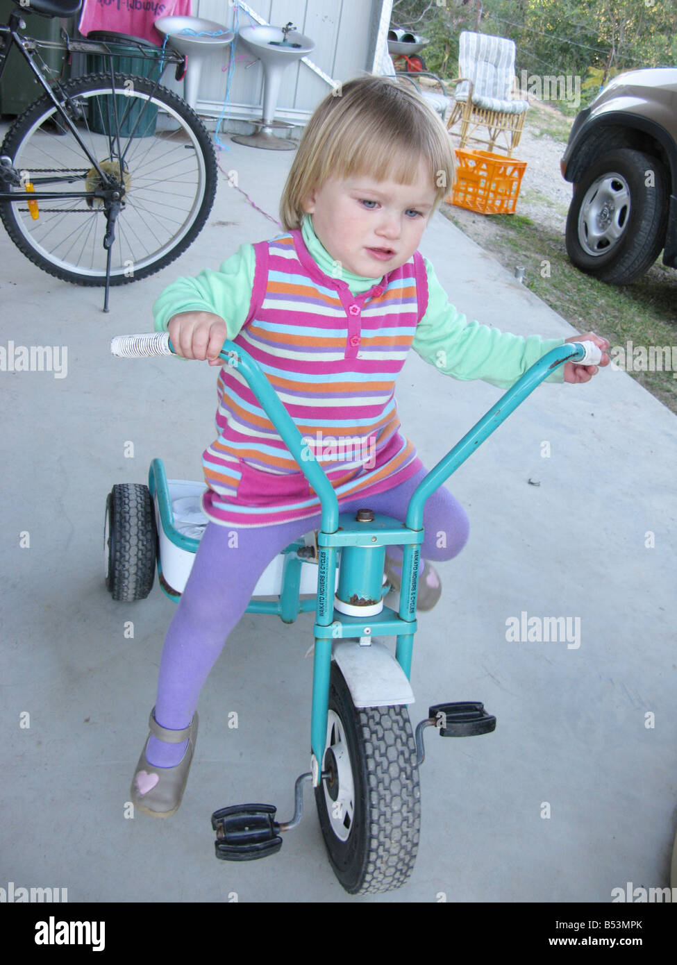 Child girl on tricycle Stock Photo Alamy