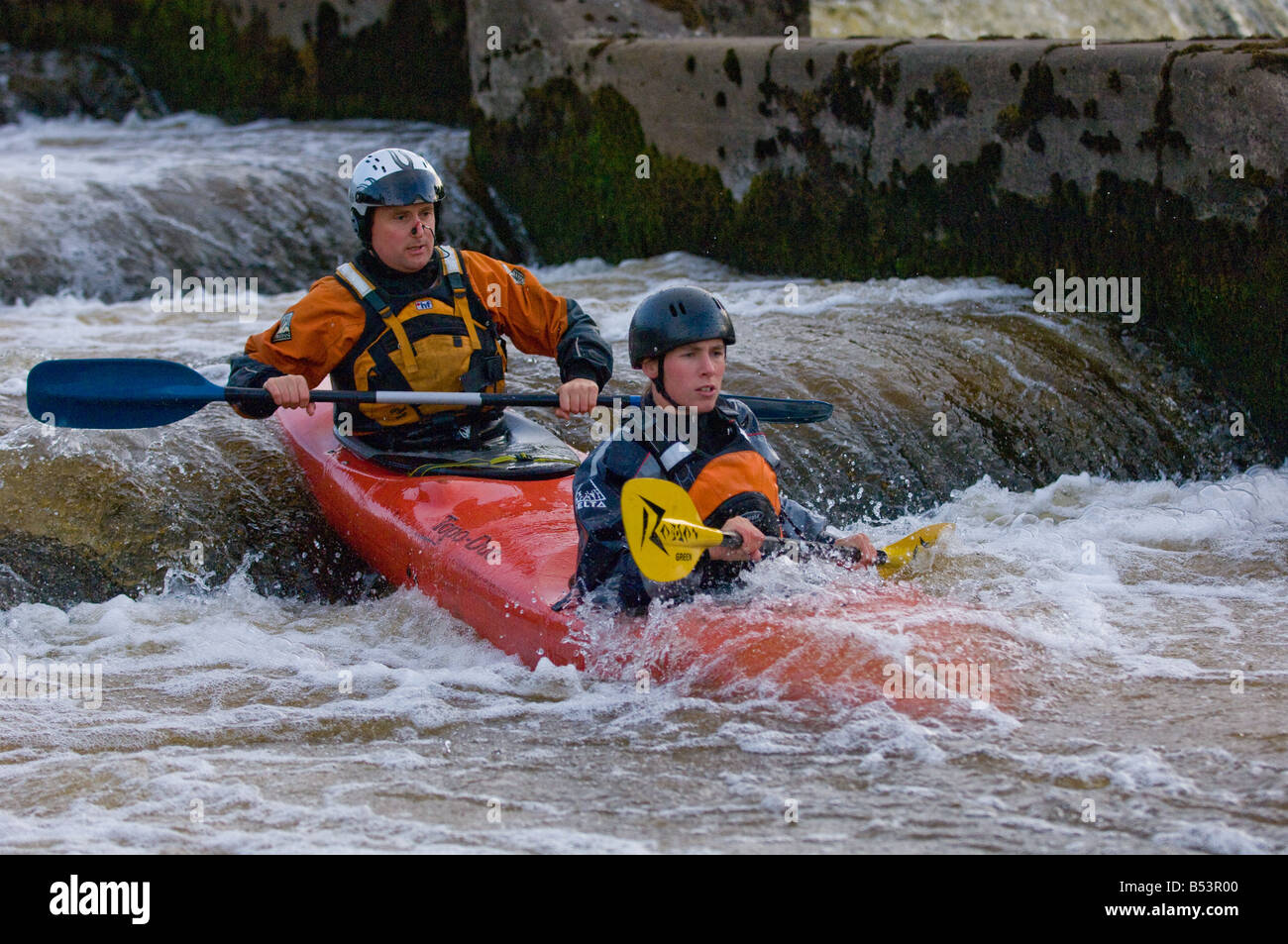 Two man Kayak white water male and female Stock Photo