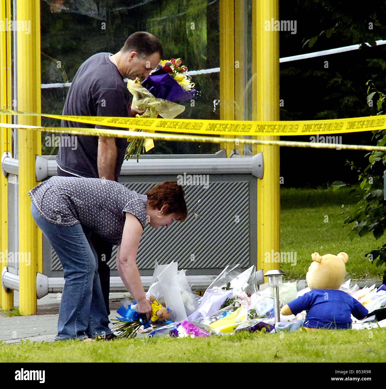 Stephen and Melanie Jones read floral tributes at The Fir Tree Pub in