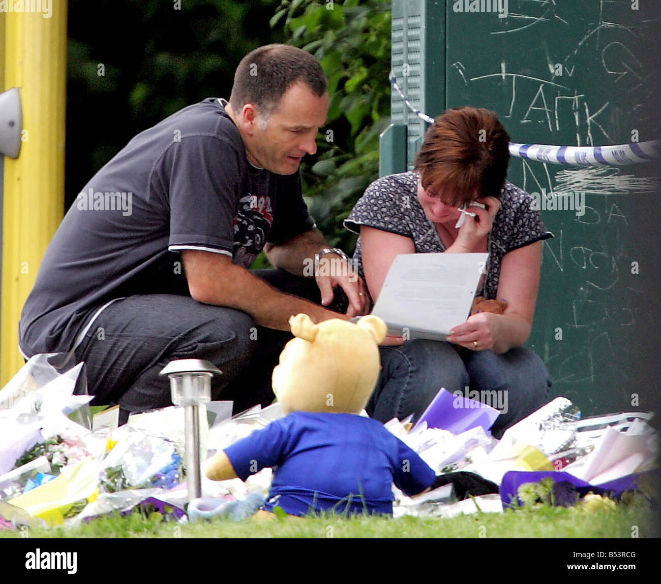 Stephen and Melanie Jones read floral tributes at The Fir Tree Pub in