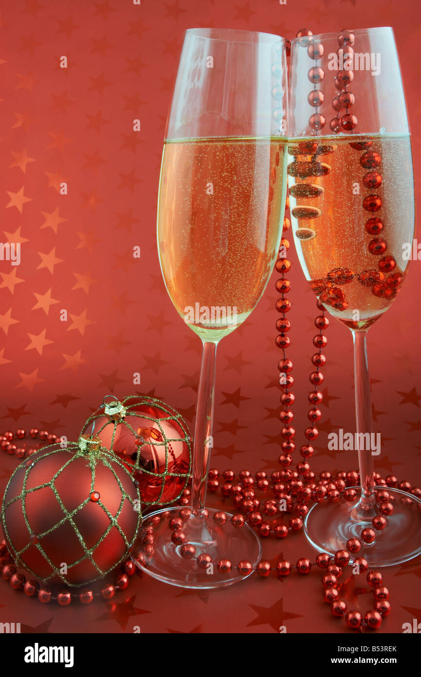 Two glasses of champagne and christmas decorations Stock Photo - Alamy