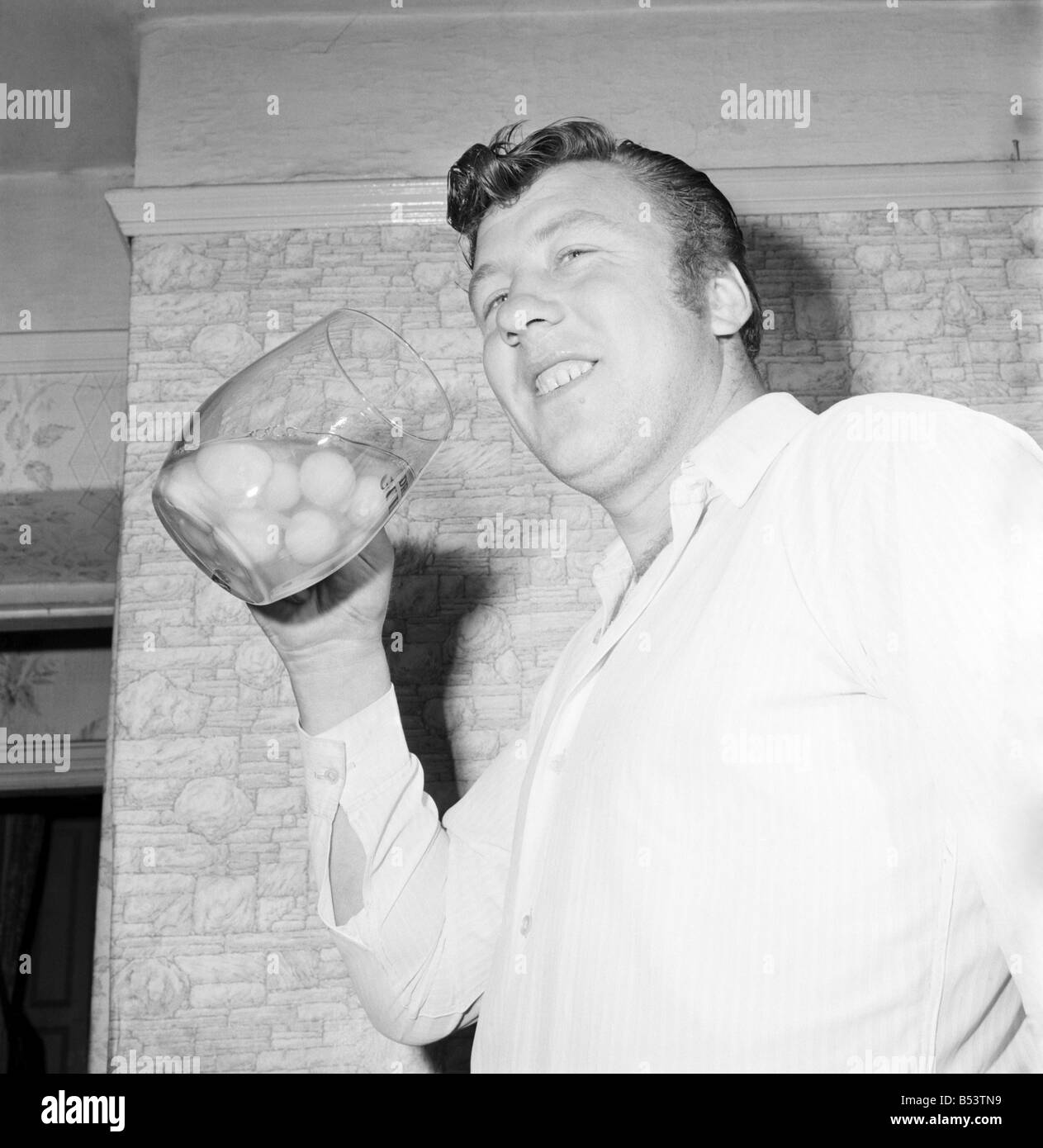 Where eggs are concerned sixteen stone steelworker Bob Irwin takes some beating. He eats them raw by the dozen as a starter to his mid-day meals. Here he is about to swallow twelve fourpenny ones in a big glass. ;November 1969 ;Z10597-001 Stock Photo