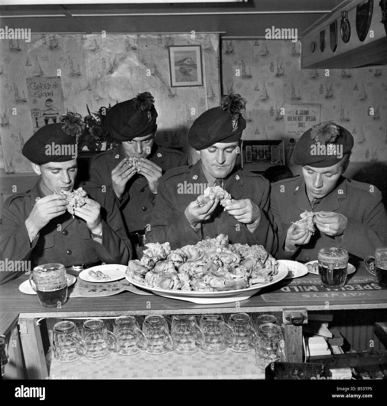 Military Army Food. Soldiers of the Irish Rangers eating pigs trotters