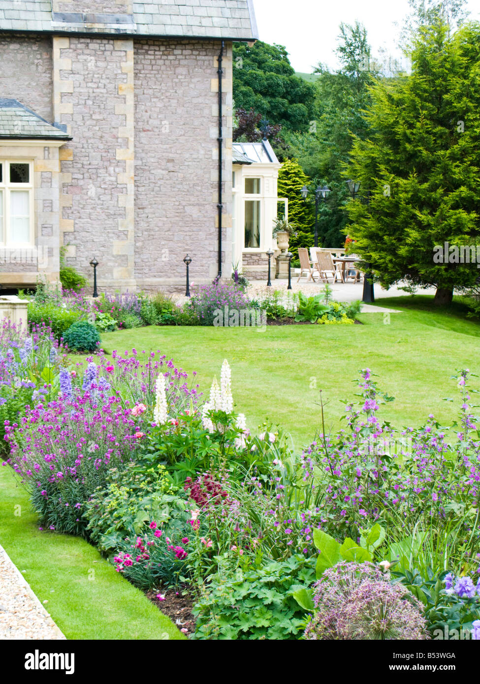flower bed in large garden, on a slope Stock Photo Alamy