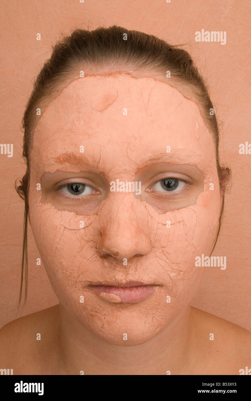 woman with clay beauty mask Stock Photo