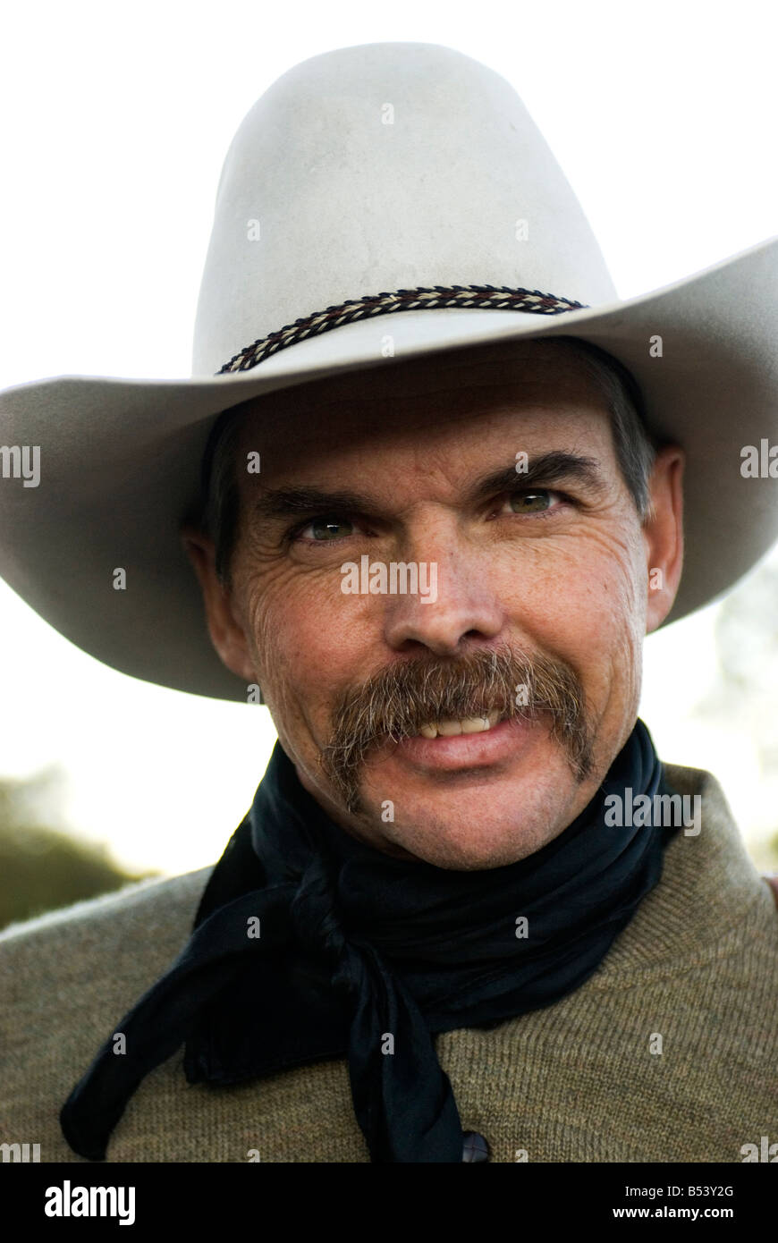 Wyoming cowboy; good looking, with a mustache and white hat on Stock