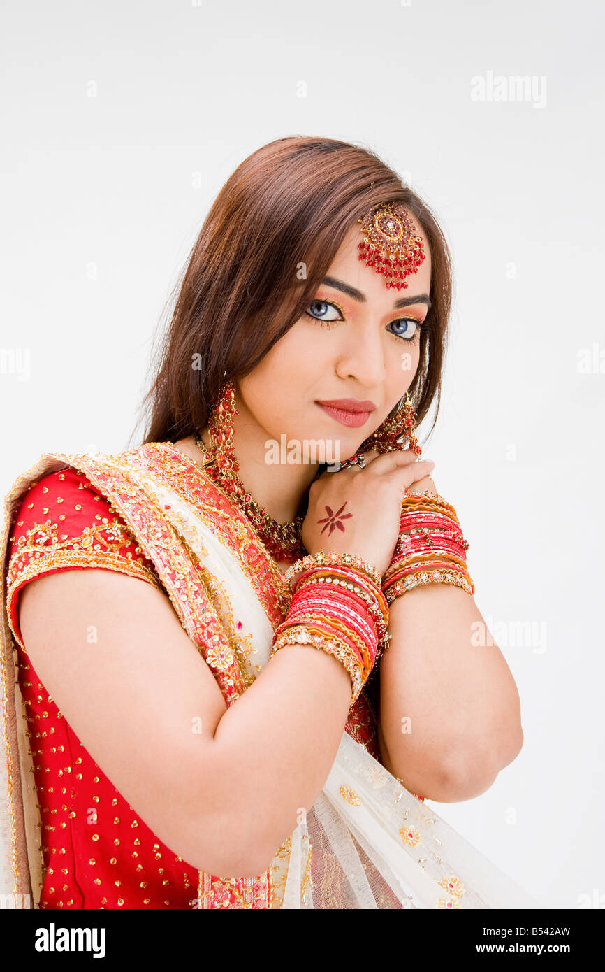 Beautiful Bangali bride in colorful dress isolated Stock Photo