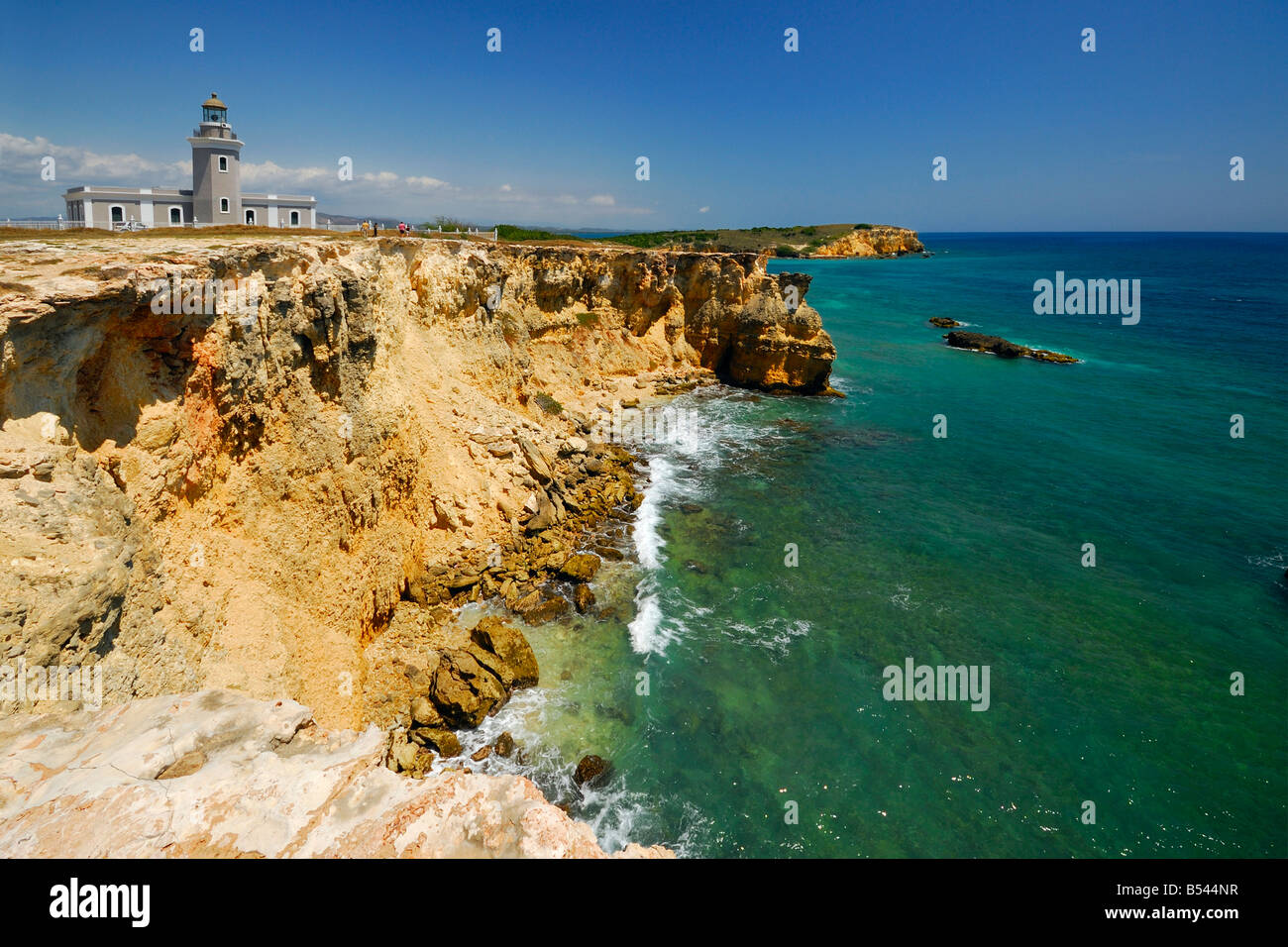 The Los Morrillos Lighthouse with it's rough cliffs and shoreline are located at the very south west tip of Puerto Rico. Stock Photo