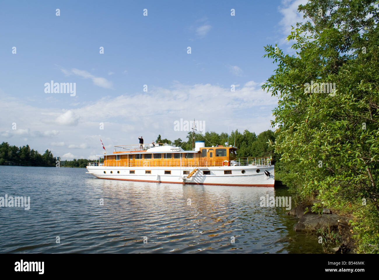 luxury yacht moored at Canadian Shield island Stock Photo