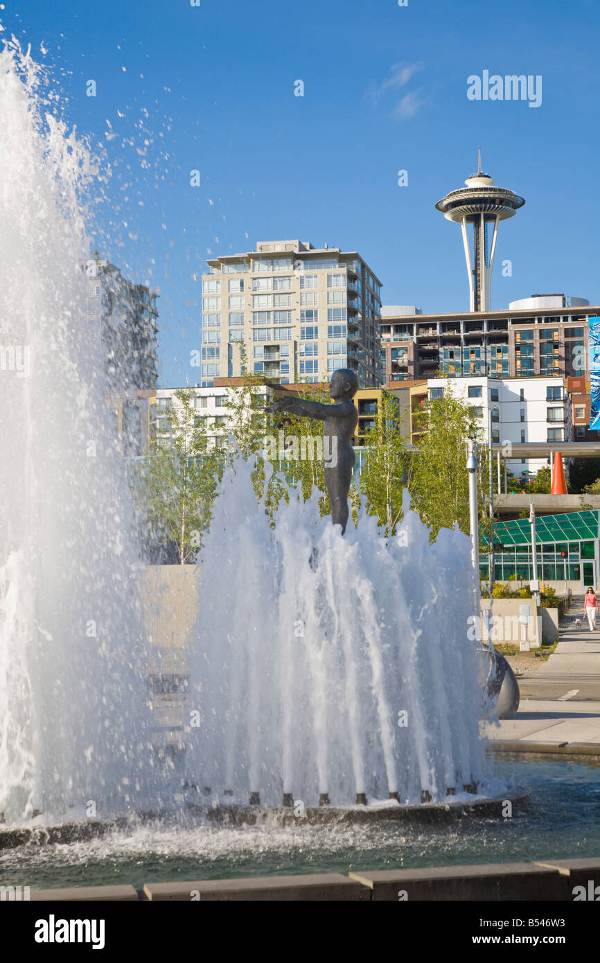 Space Needle rises behind water fountain in the Seattle Sculpture Park