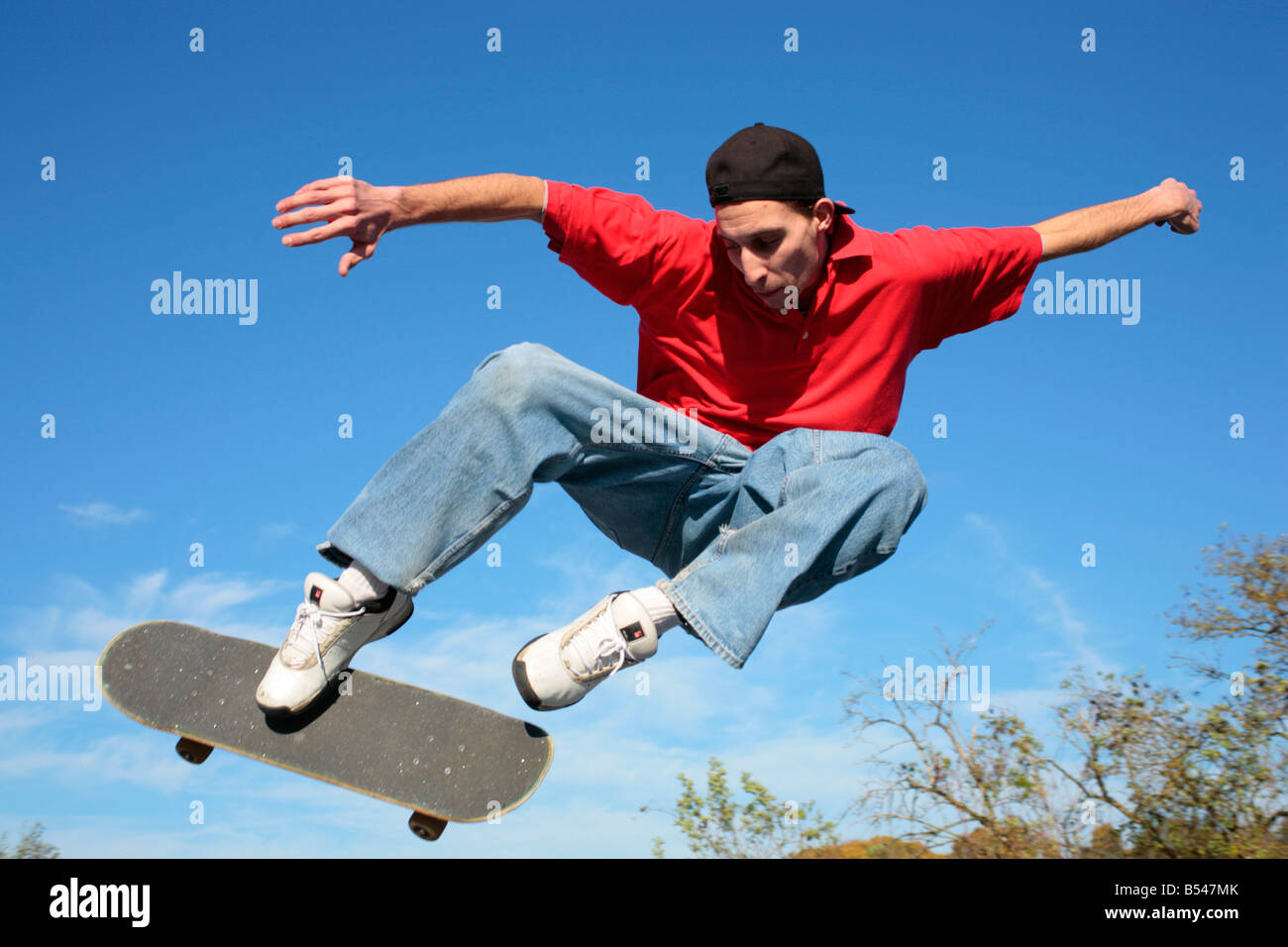 young man jumping with his skateboard Stock Photo