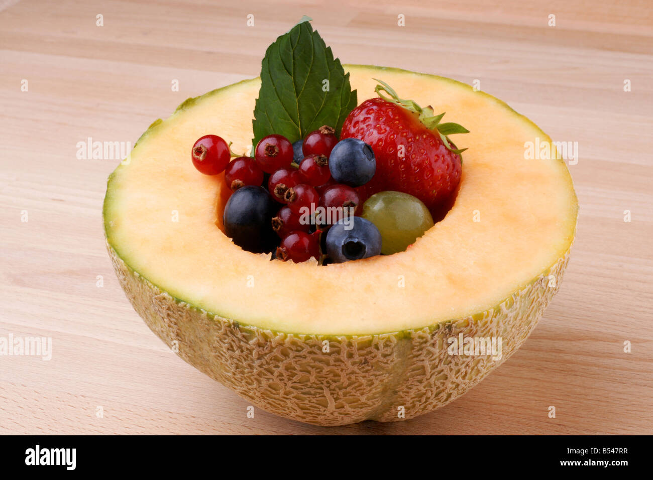 Fruits on wooden background Stock Photo
