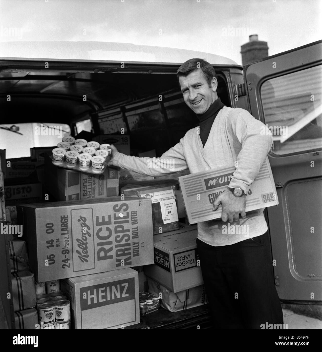 Ex Blackburn and England winger Bryan Douglas loading his grocery van ready for a day on the market. Since retiring from first class football Bryan sells on Clitheroe market two days per week. ;November 1969 ;Z10745-001 Stock Photo