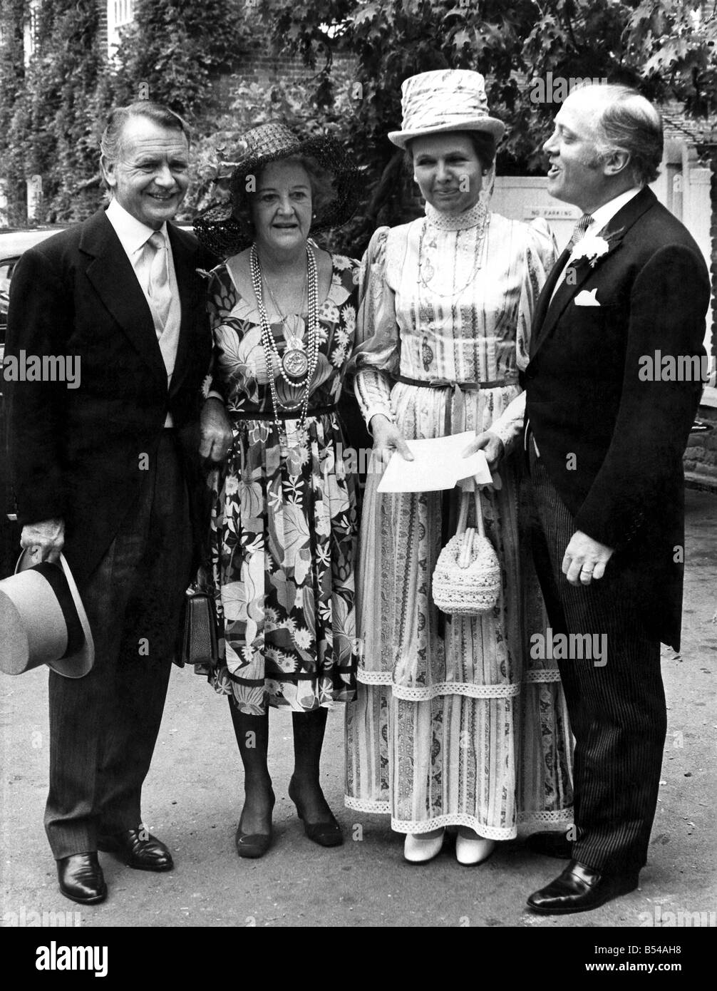 There was a star-studded cast of guests at Denham, Buckinghamshire, on Saturday (10-7-71) when Michael Attenborough married 20-year-old Joyce Frankenberg - better known as actress Jane Seymour. At the picturesque little parish church were Michael's parents, actor Richard Attenborough and actress Sylvia Sims, actor John Mills and his wife, authoress Mary Hayley Bell, and actor Jack Hawkins. Arriving for the wedding - (from left) John Mills and Mary Hayley Bell, Sylvia Sims and Richard Attenborough. ;July 1971 ;P016942 Stock Photo