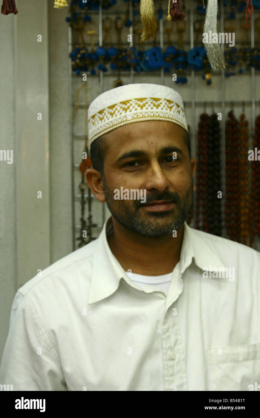 Indian muslim man work in shop, kuwait Stock Photo