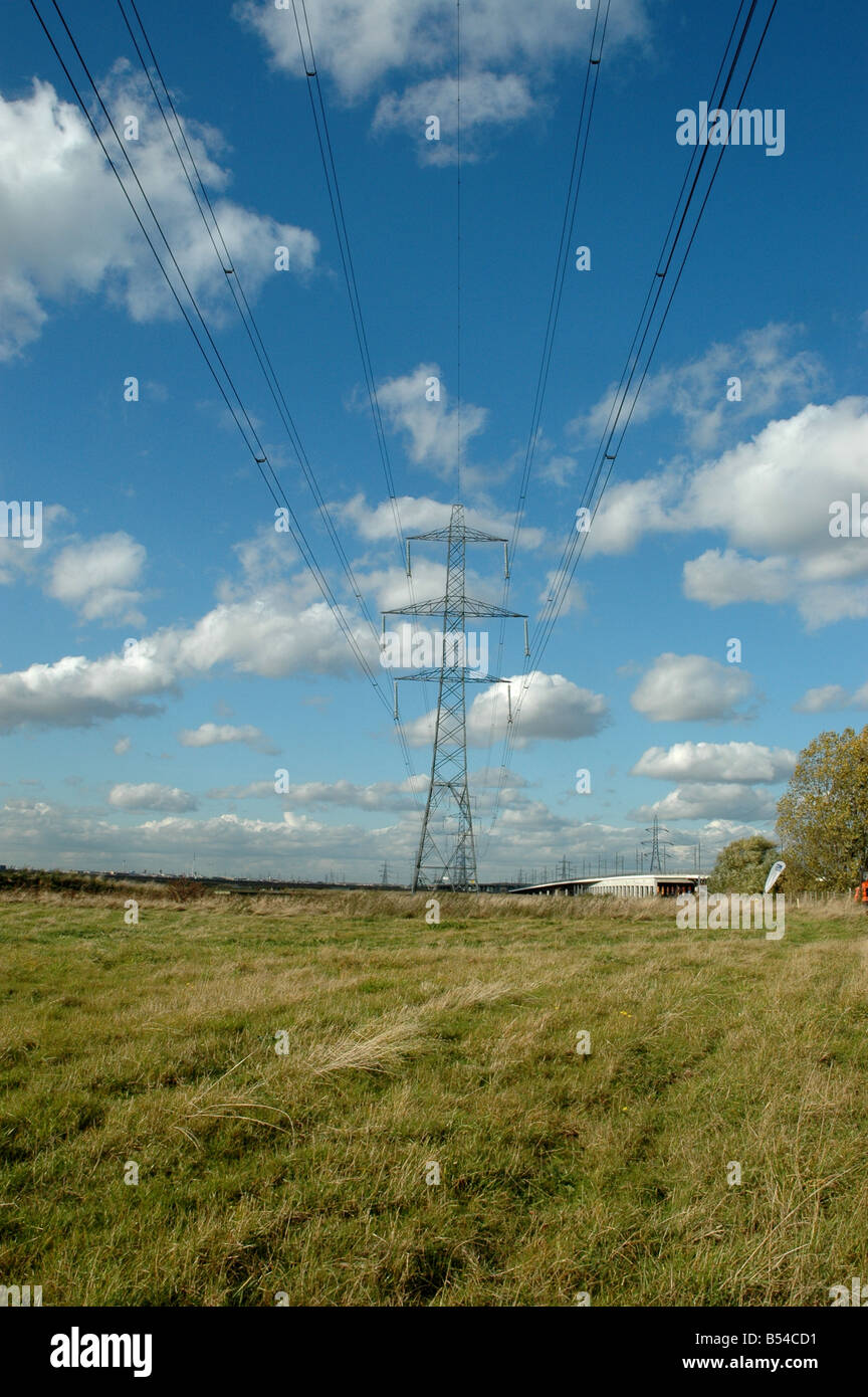 An electricity pylon with blue sky above Stock Photo - Alamy