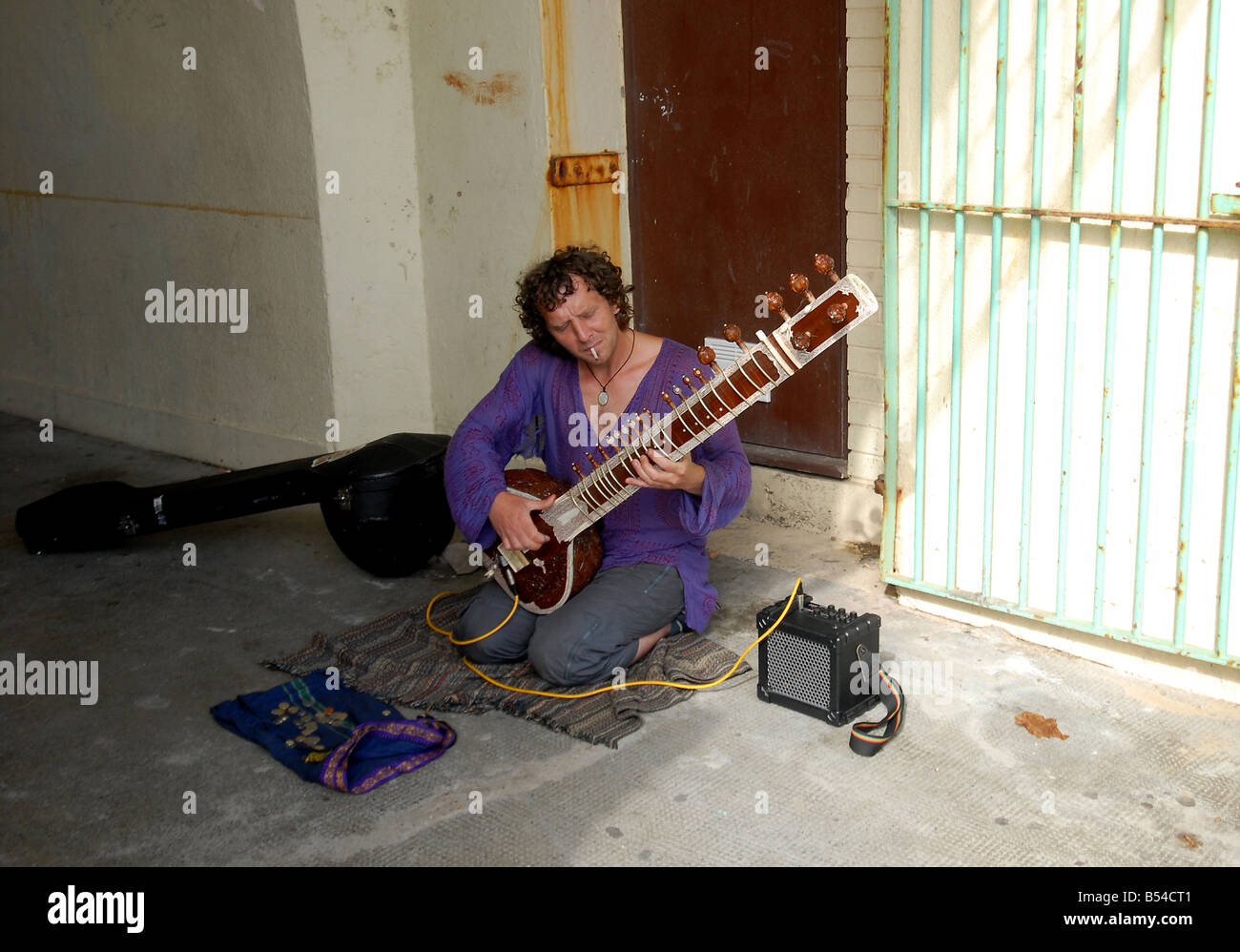 Busker with unusual instrument Stock Photo - Alamy