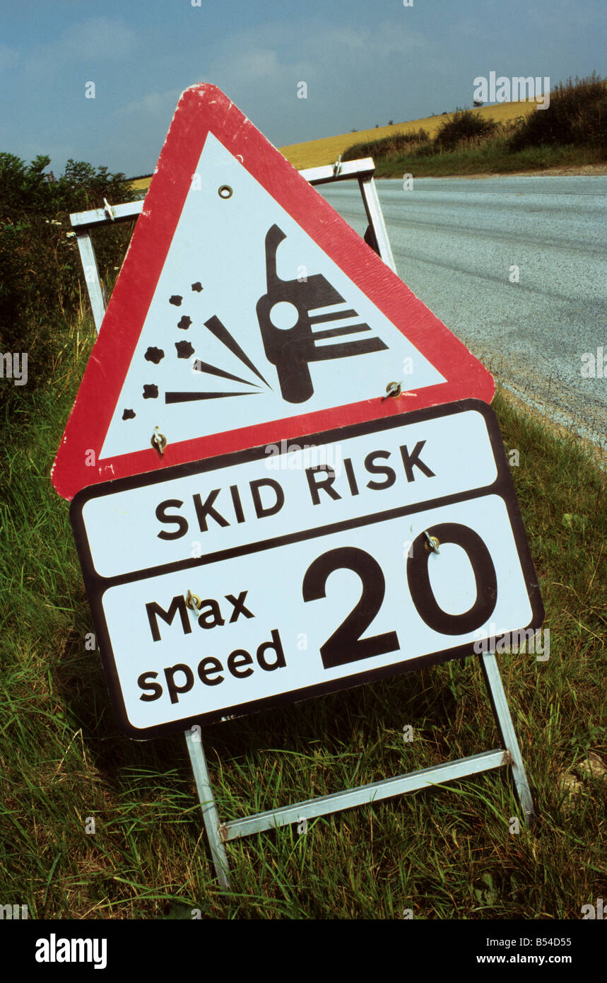warning sign of skid risk on newly resurfaced country road near Leeds