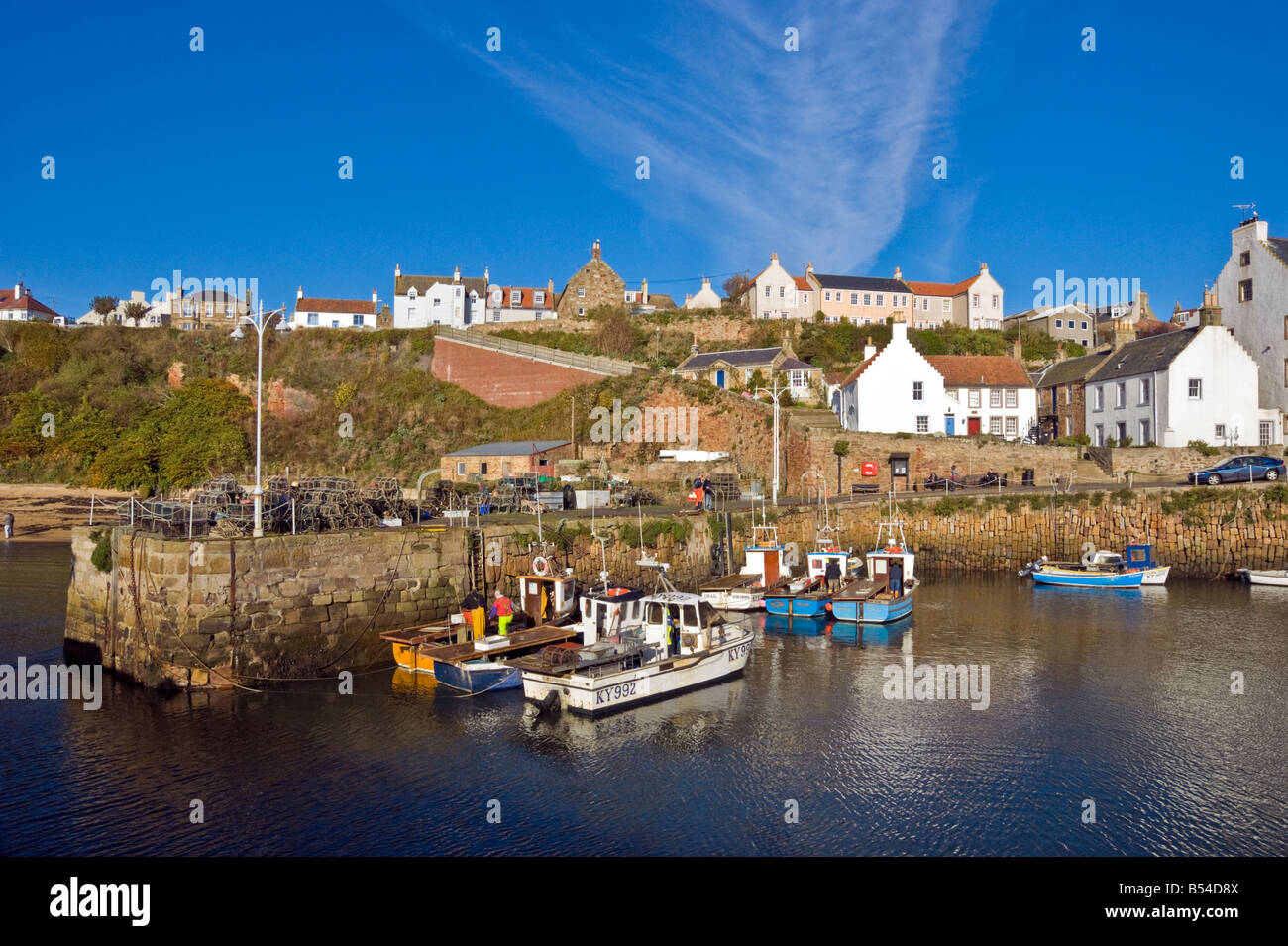 Crail harbour Fife Scotland on a sunny autumn day with moored fishing boats Stock Photo