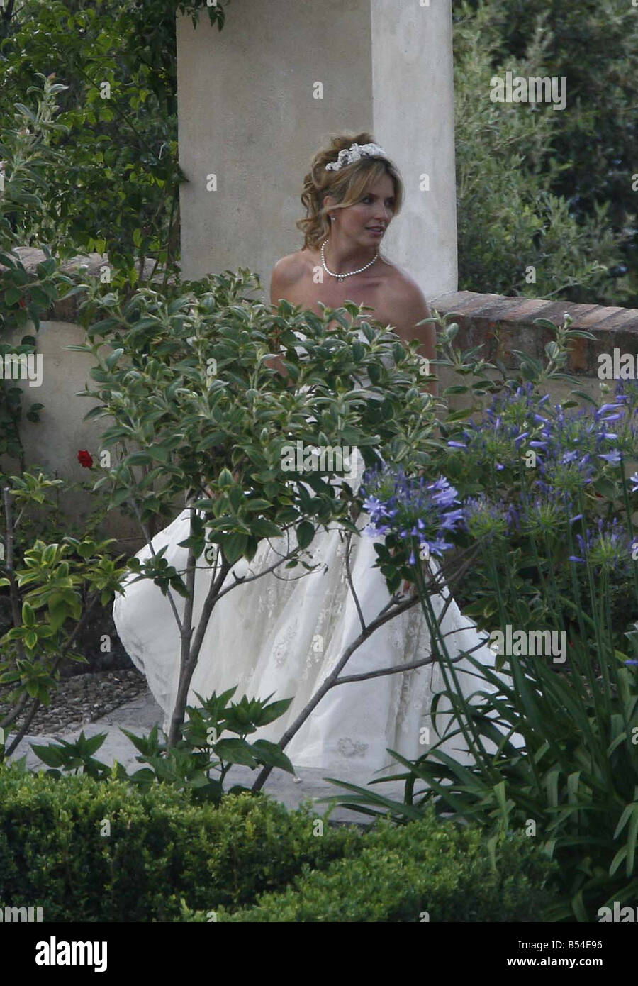 Penny Lancaster in wedding dress posing for photographs Stock Photo
