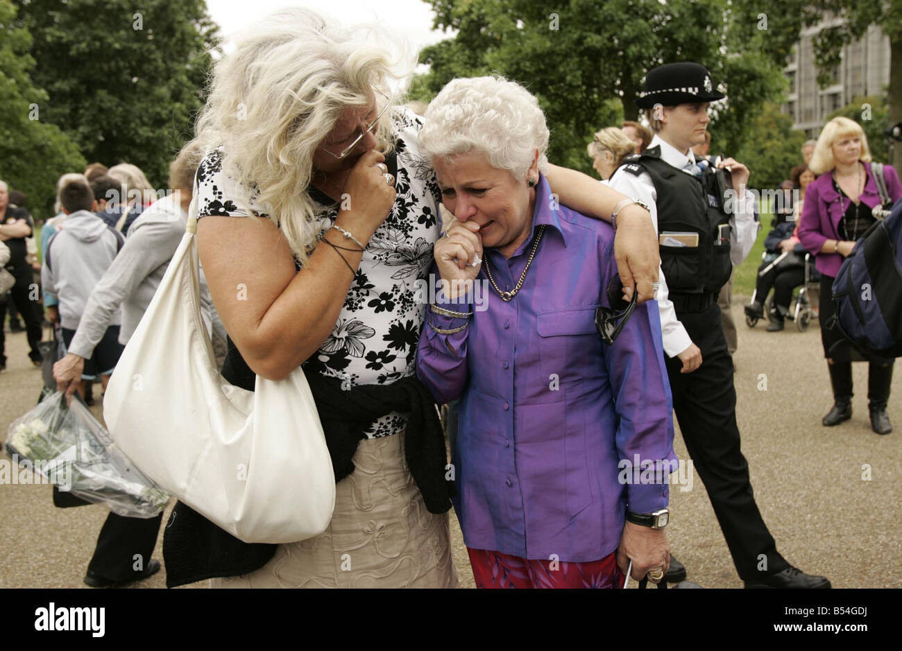 Members of the public listen on to the memorial service held for Princess Diana at the Guards Chapel in London on the 10th anniversary of her death Some are so overcome with emotion they begin to cry Stock Photo