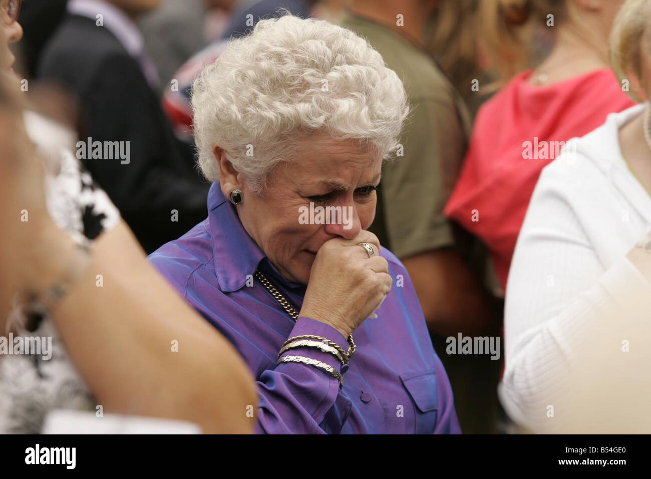 Members of the public listen on to the memorial service held for Princess Diana at the Guards Chapel in London on the 10th anniversary of her death Some are overcome with emotion and start to cry Stock Photo