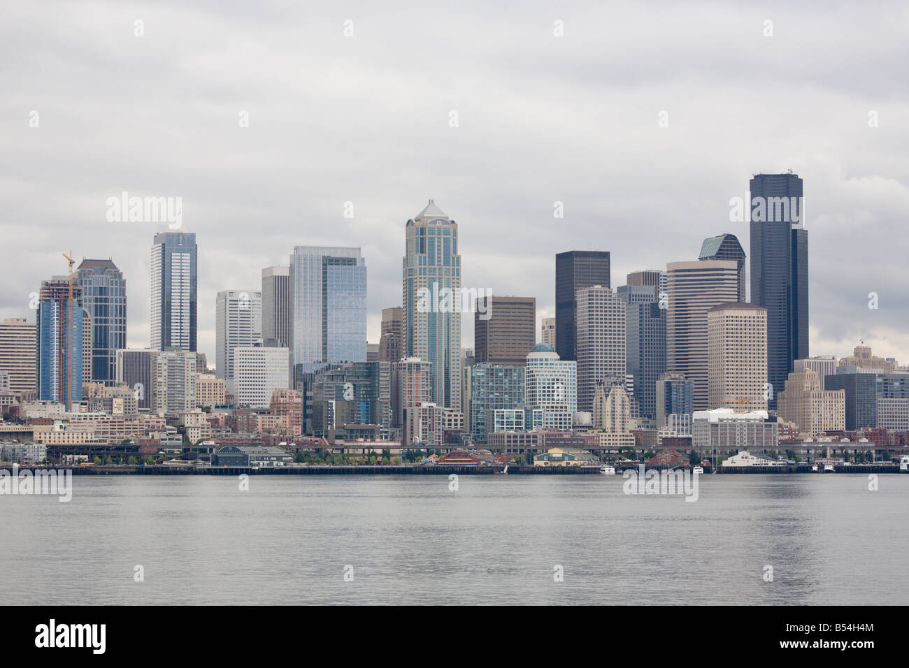 Downtown Seattle Washington skyline on a typical cloudy day from Elliot Bay in Puget Sound Stock Photo