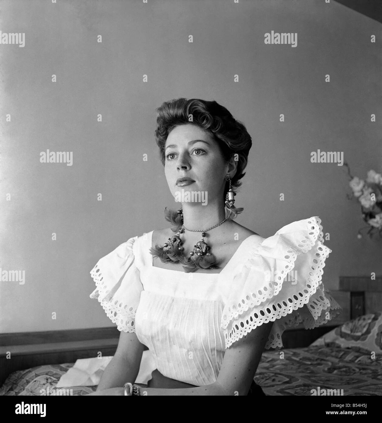 27 year old French film actress Anne Vernon, photographed in her Savoy river suite. She will begin rehearsals for the Broadway production of the 'Little Hut' now playing at the Lyric. Blue-eyed brunette Mlle. Vernon is said to have the most beautiful mouth in the world. ;July 1953 ;D3746-001 Stock Photo