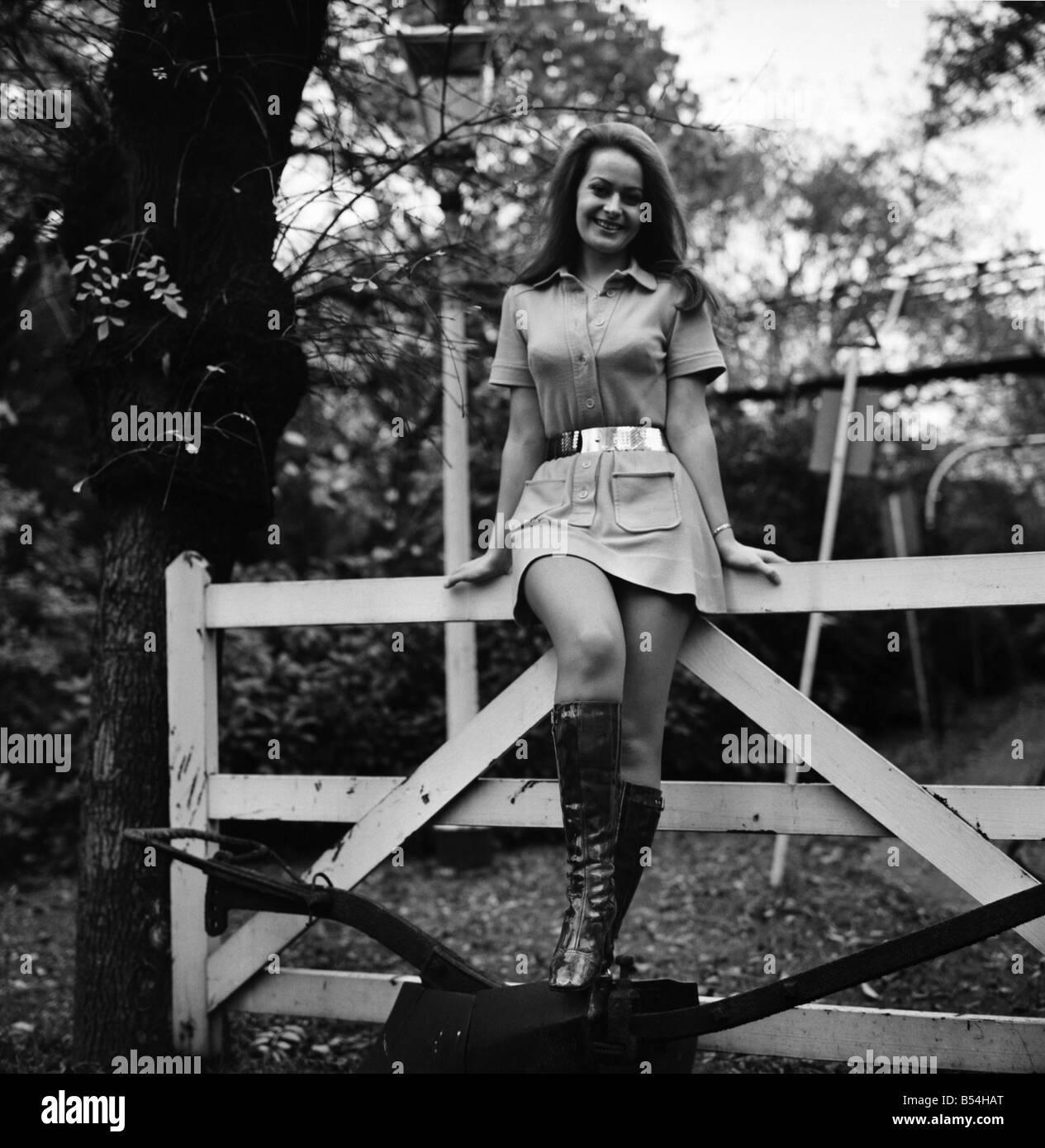 Woman wearing mini dress with belt across the waist and knee high boots.  
October 1969 
Z10484-002 Stock Photo - Alamy