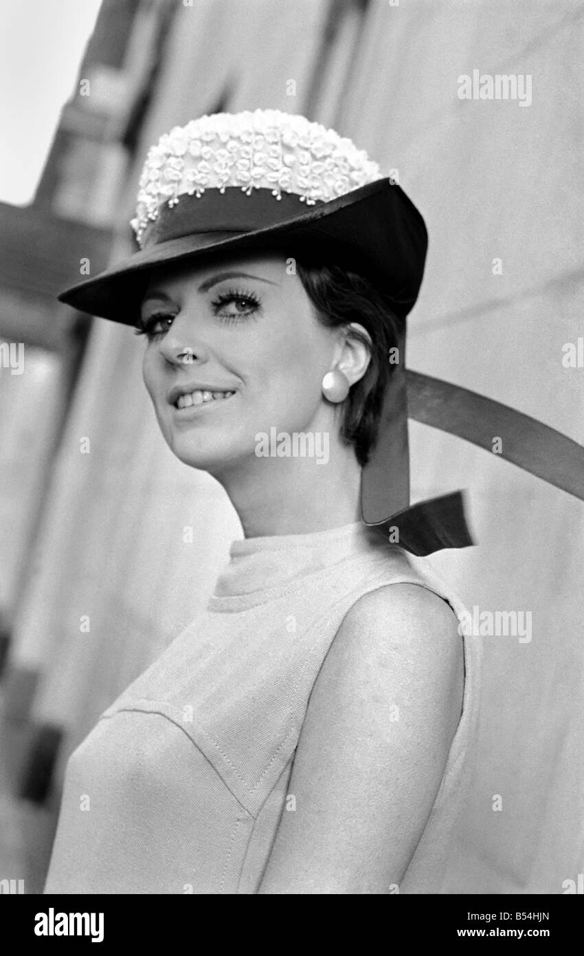 The Millinery Guild showed their Spring Collection of hats at the Dorchester, London. Lois James in hat from Ronsons, a Dolly Vardon, the light navy laize braim is combined with a crown of lily of the valley, and the Embassy red velvet ribbon. ;November 1969 ;Z10821-006 Stock Photo