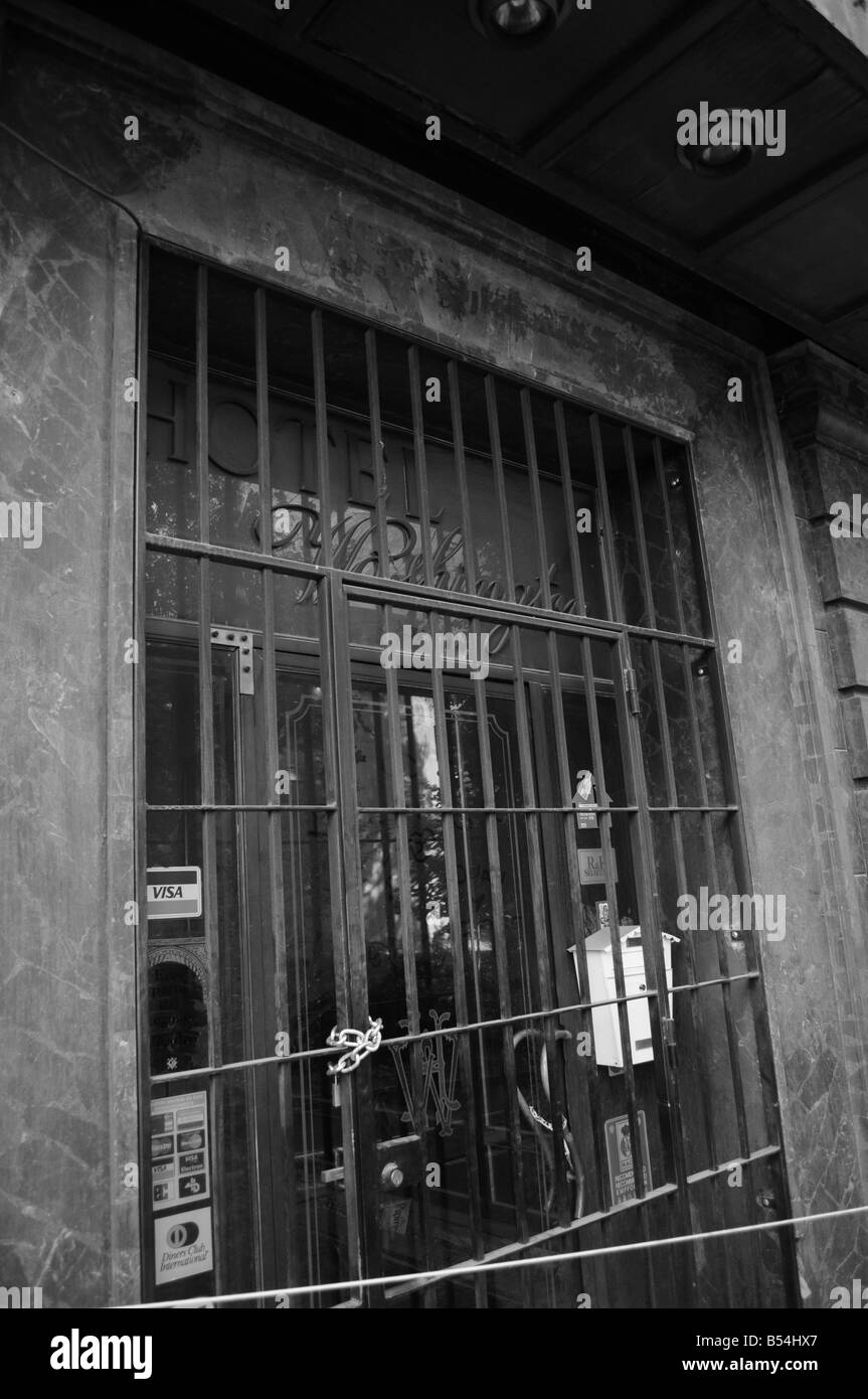 Locked entrance to the old Washington Irving Hotel, Paseo del Generalife, Granada, Andalusia, Spain. Monochrome. Stock Photo