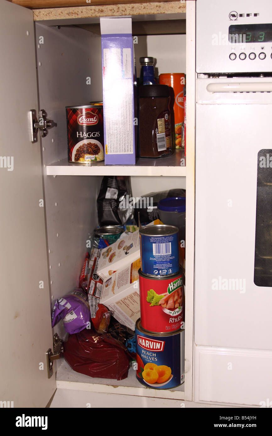 Kitchen cupboard open and foodstuffs hires stock photography and