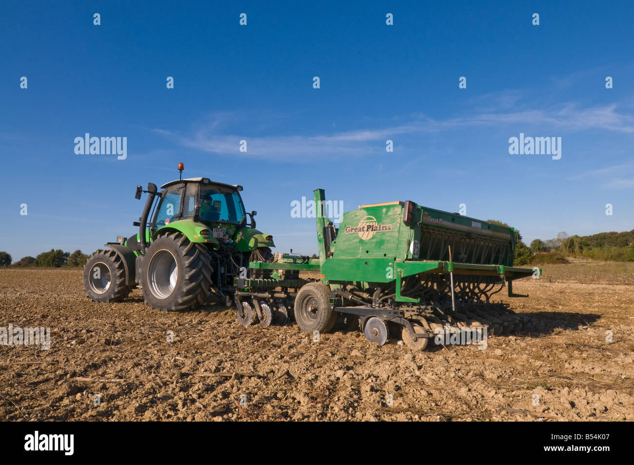 'Deutz-Fahr' tractor towing 'Great Plains' combined harrow and seed drill - sowing Winter Wheat, Indre-et-Loire, France. Stock Photo